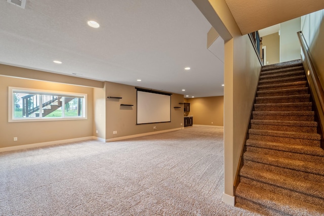 916 NE Silkwood St, Grimes, IA 50111 - basement featuring carpet flooring, stairway, baseboards, and recessed lighting