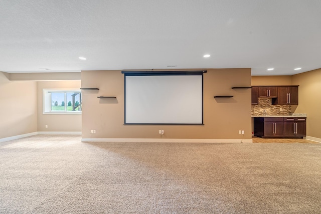 916 NE Silkwood St, Grimes, IA 50111 - home theater room with light carpet, recessed lighting, and baseboards