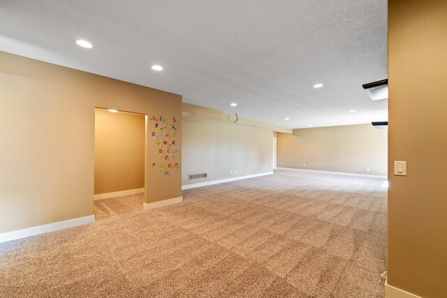 916 NE Silkwood St, Grimes, IA 50111 - empty room with recessed lighting, light colored carpet, and baseboards
