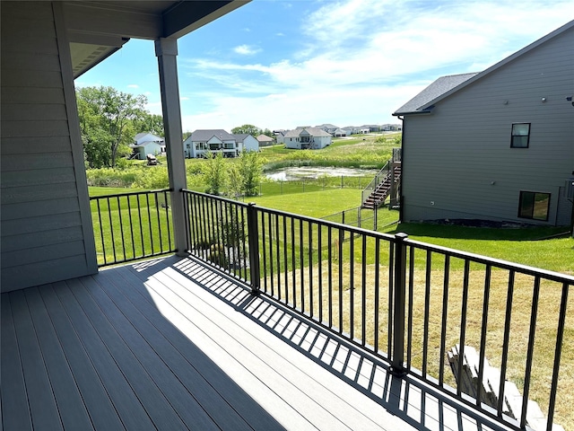 16332 Northpark Dr, Urbandale, IA 50323 - wooden terrace with a lawn, a residential view, and a water view
