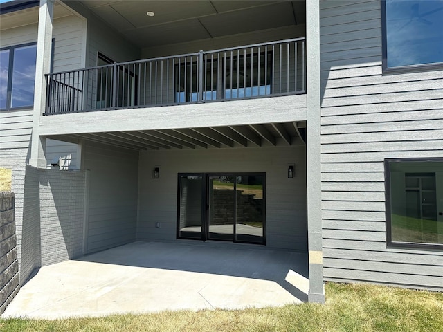 16332 Northpark Dr, Urbandale, IA 50323 - rear view of property featuring a balcony and a patio
