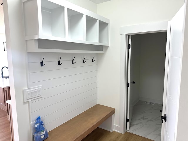 16332 Northpark Dr, Urbandale, IA 50323 - mudroom with marble finish flooring and baseboards