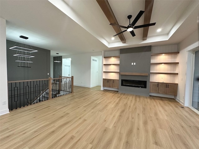16332 Northpark Dr, Urbandale, IA 50323 - unfurnished living room featuring light wood-style floors, a raised ceiling, baseboards, ceiling fan, and recessed lighting