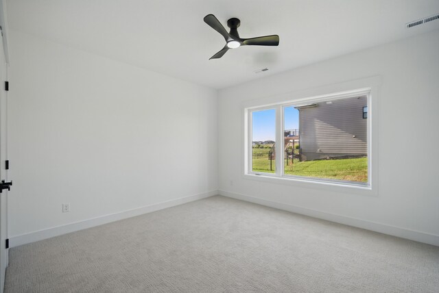 16332 Northpark Dr, Urbandale, IA 50323 - empty room featuring carpet flooring, baseboards, and ceiling fan