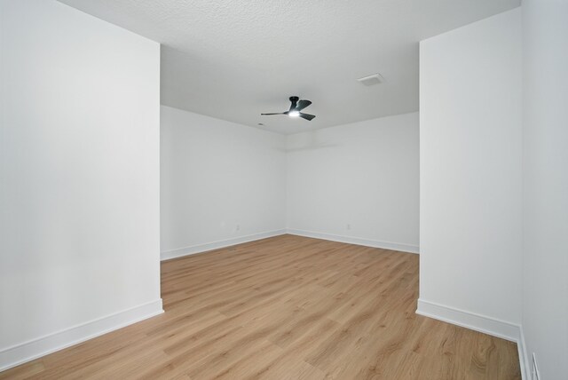 16332 Northpark Dr, Urbandale, IA 50323 - empty room featuring light wood-style flooring, ceiling fan, and baseboards