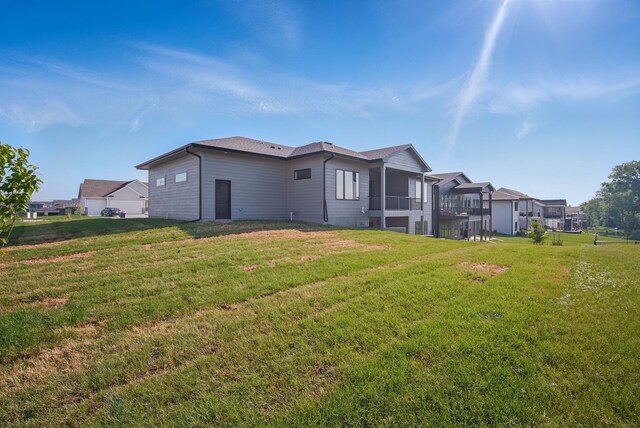 16332 Northpark Dr, Urbandale, IA 50323 - back of property featuring a lawn