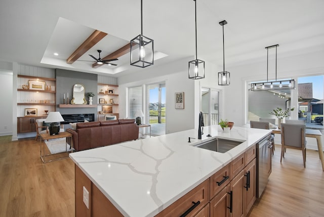 16332 Northpark Dr, Urbandale, IA 50323 - kitchen with a sink, ceiling fan, light wood-style floors, decorative light fixtures, and recessed lighting