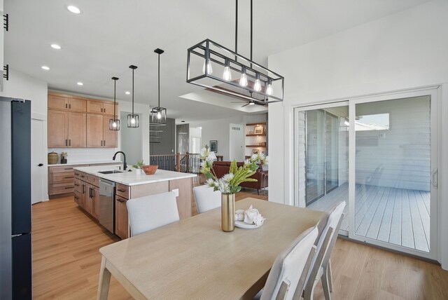 16332 Northpark Dr, Urbandale, IA 50323 - dining area featuring light wood-type flooring and recessed lighting
