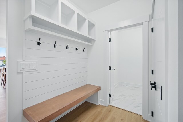 16332 Northpark Dr, Urbandale, IA 50323 - mudroom featuring baseboards and light marble finish floors