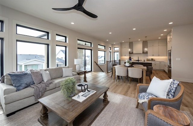 6204 Aspen Dr, West Des Moines, IA 50266 - living area with light wood-style floors, ceiling fan, and recessed lighting