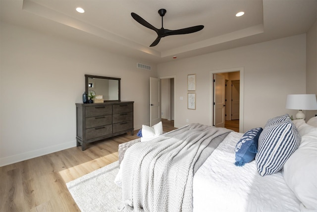 6204 Aspen Dr, West Des Moines, IA 50266 - bedroom with a tray ceiling, light wood-style floors, recessed lighting, baseboards, and ceiling fan