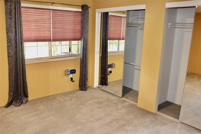 730 Kitterman Cir, Norwalk, IA 50211 - unfurnished bedroom featuring carpet floors and multiple closets