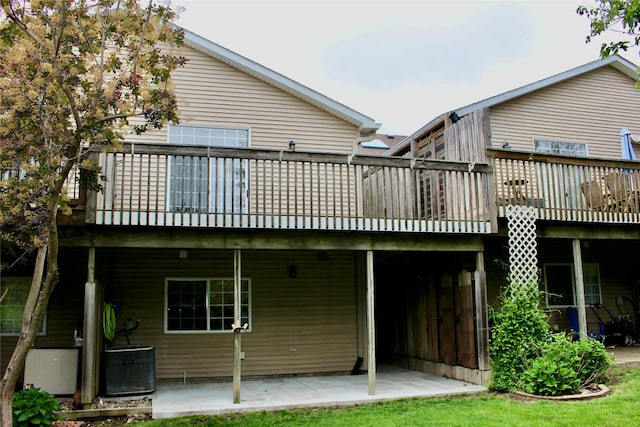 730 Kitterman Cir, Norwalk, IA 50211 - back of property featuring central AC unit, a deck, and a patio