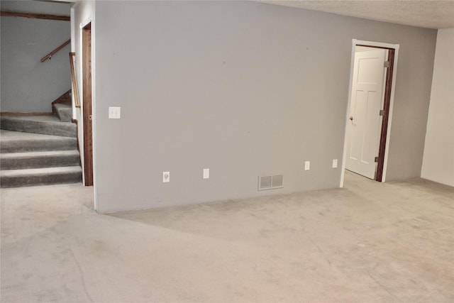 730 Kitterman Cir, Norwalk, IA 50211 - unfurnished living room with carpet flooring and stairs