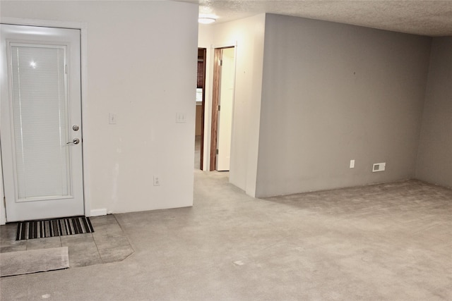 730 Kitterman Cir, Norwalk, IA 50211 - spare room featuring carpet flooring and a textured ceiling