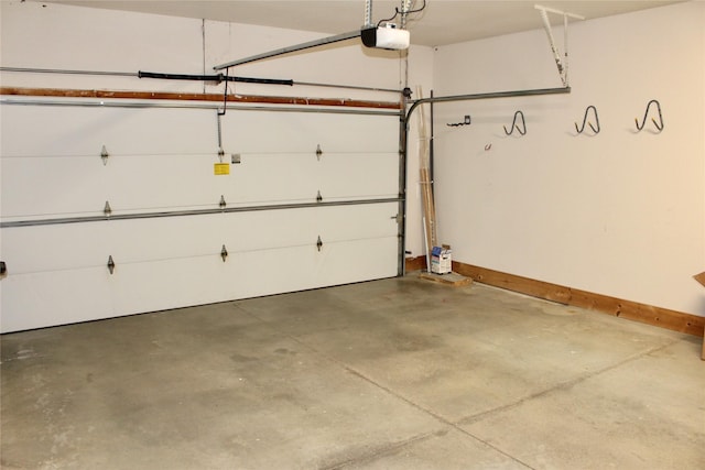 730 Kitterman Cir, Norwalk, IA 50211 - garage with a garage door opener and baseboards