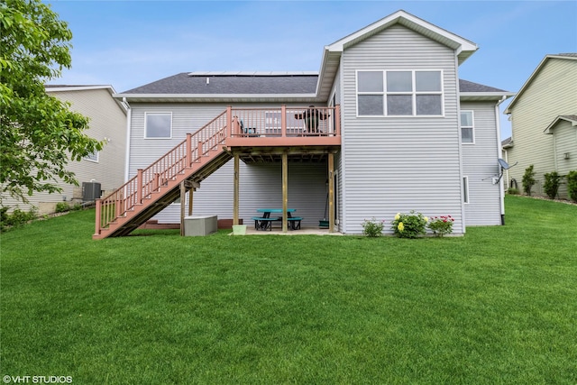 703 NE 46th Ct, Ankeny, IA 50021 - back of property featuring a deck, stairs, a yard, and roof with shingles