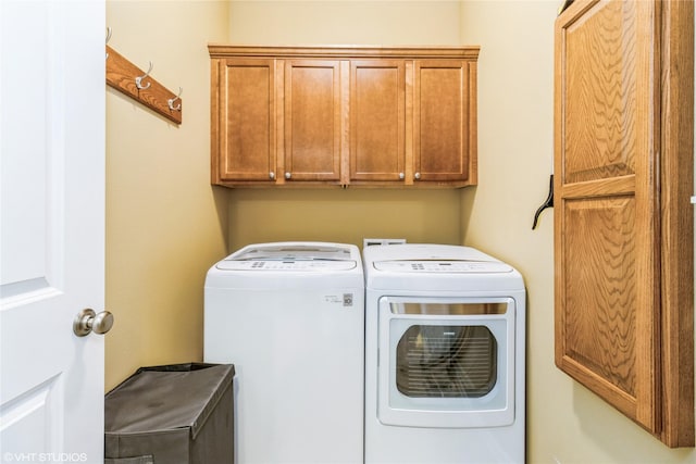 703 NE 46th Ct, Ankeny, IA 50021 - laundry area with cabinet space and washing machine and dryer