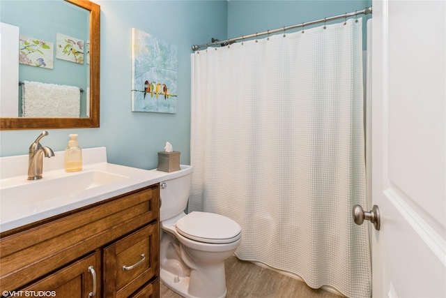 703 NE 46th Ct, Ankeny, IA 50021 - bathroom featuring vanity, toilet, wood finished floors, and a shower with curtain
