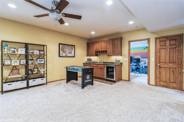 703 NE 46th Ct, Ankeny, IA 50021 - rec room with wine cooler, light carpet, recessed lighting, a ceiling fan, and baseboards