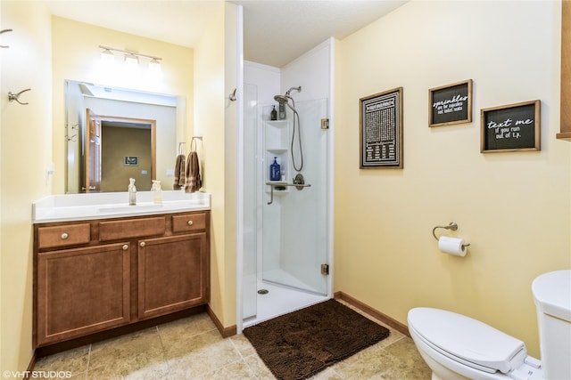 703 NE 46th Ct, Ankeny, IA 50021 - bathroom with a shower stall, vanity, toilet, tile patterned floors, and baseboards