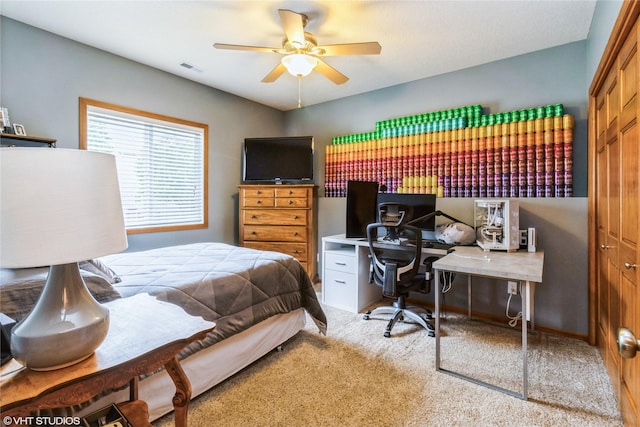 703 NE 46th Ct, Ankeny, IA 50021 - bedroom with carpet, a desk, a closet, and a ceiling fan