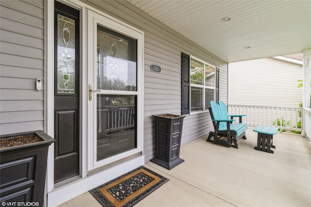 703 NE 46th Ct, Ankeny, IA 50021 - property entrance with a porch