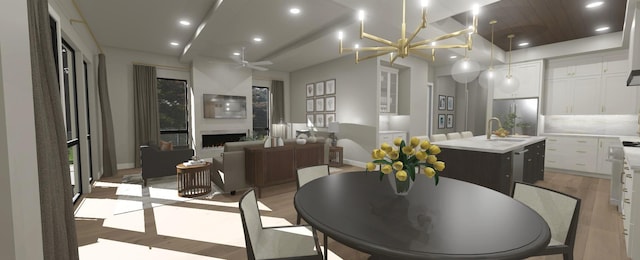 200 S Shore Dr Unit 101, Clear Lake, IA 50428 - dining space with light wood finished floors, baseboards, recessed lighting, a fireplace, and ceiling fan