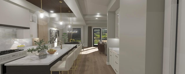200 S Shore Dr Unit 101, Clear Lake, IA 50428 - bathroom with wood finished floors, recessed lighting, tasteful backsplash, and vanity