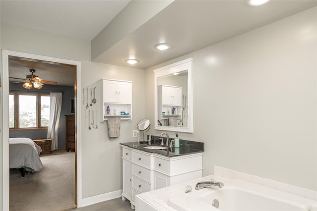 10490 Elmcrest Dr, Clive, IA 50325 - ensuite bathroom featuring vanity, a bath, and a ceiling fan
