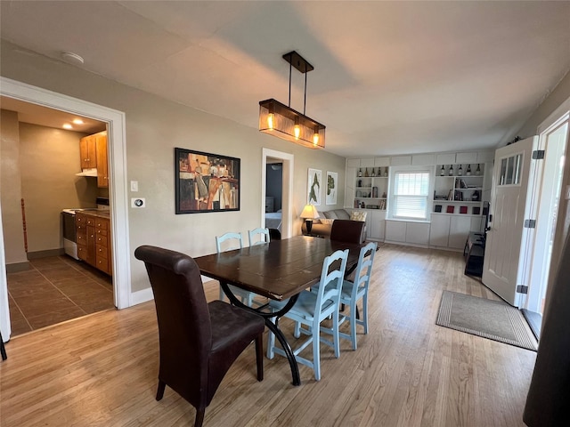 311 W 8th St S, Newton, IA 50208 - dining space with light wood finished floors and baseboards