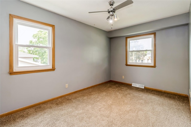 602 SE 7th St, Ankeny, IA 50021 - carpeted empty room featuring baseboards and ceiling fan