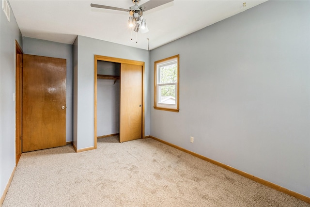 602 SE 7th St, Ankeny, IA 50021 - unfurnished bedroom featuring carpet floors, baseboards, a closet, and a ceiling fan