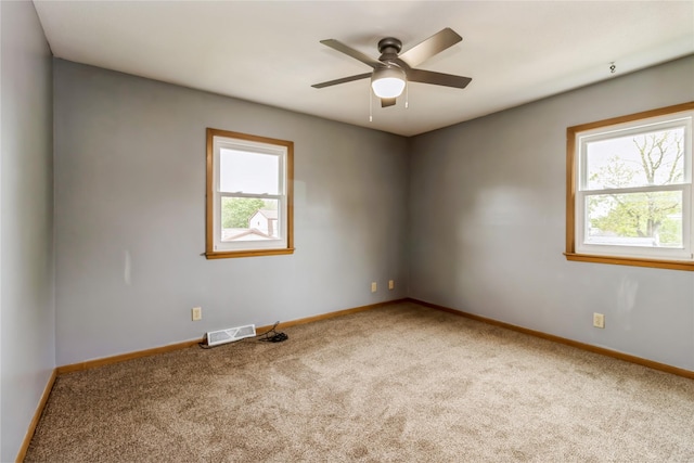 602 SE 7th St, Ankeny, IA 50021 - carpeted empty room featuring baseboards and a ceiling fan