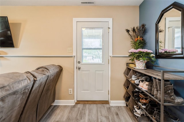 602 SE 7th St, Ankeny, IA 50021 - doorway with wood finished floors, healthy amount of natural light, and baseboards