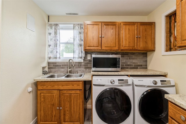 602 SE 7th St, Ankeny, IA 50021 - washroom featuring washing machine and clothes dryer, cabinet space, and baseboards
