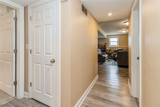 602 SE 7th St, Ankeny, IA 50021 - corridor with light wood-type flooring and baseboards