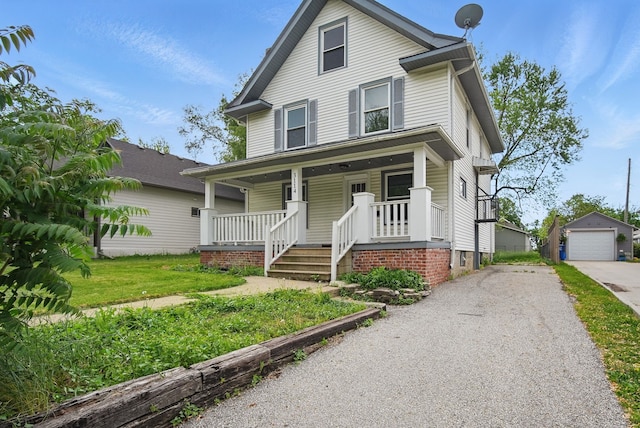 3114 School St, Des Moines, IA 50311 - traditional style home featuring covered porch, driveway, a garage, and an outdoor structure