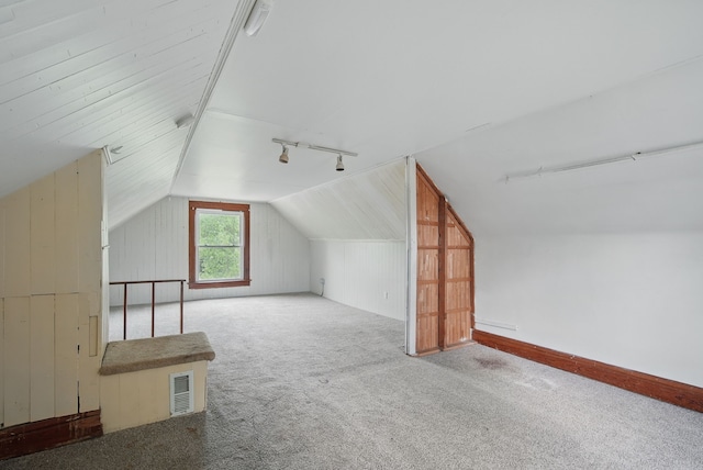 3114 School St, Des Moines, IA 50311 - additional living space with lofted ceiling, carpet flooring, and wooden walls