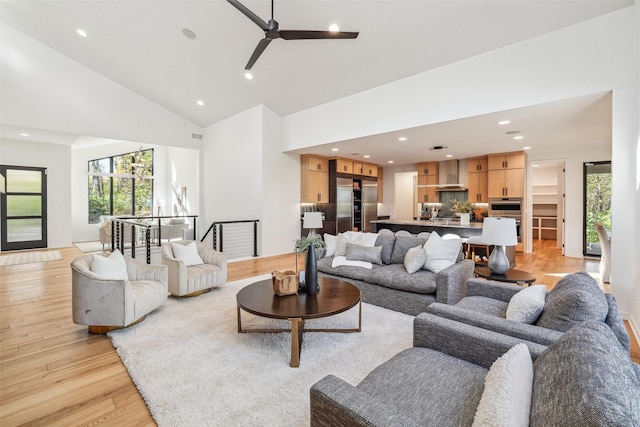 5705 SW Landview Dr, West Des Moines, IA 50265 - living room featuring a ceiling fan, recessed lighting, light wood-style flooring, high vaulted ceiling, and plenty of natural light