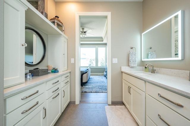 2315 14th St SW, Altoona, IA 50009 - full bath with vanity, a ceiling fan, baseboards, and ensuite bath