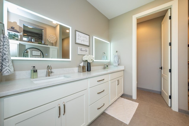 2315 14th St SW, Altoona, IA 50009 - full bathroom with double vanity, tile patterned flooring, and baseboards