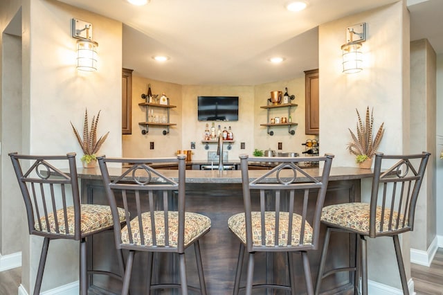 2315 14th St SW, Altoona, IA 50009 - bar area with baseboards, wood finished floors, and recessed lighting
