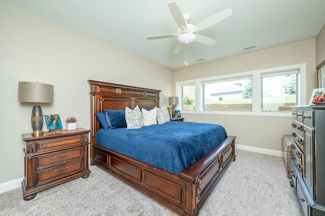 2315 14th St SW, Altoona, IA 50009 - bedroom featuring light carpet, baseboards, and ceiling fan