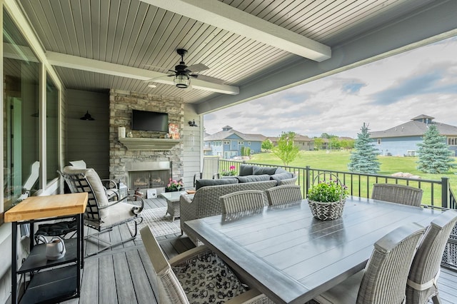 2315 14th St SW, Altoona, IA 50009 - wooden deck featuring an outdoor living space with a fireplace, a ceiling fan, a yard, and outdoor dining area