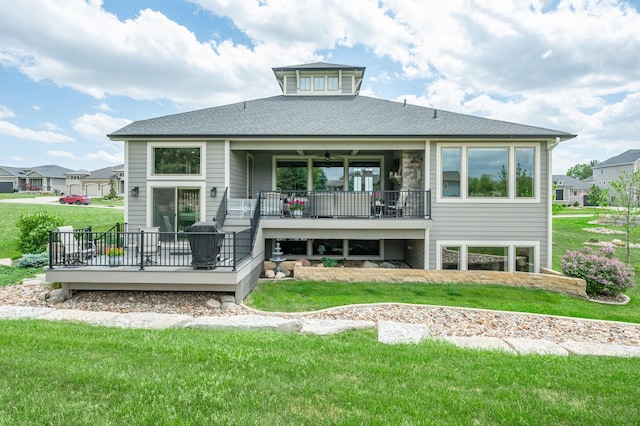 2315 14th St SW, Altoona, IA 50009 - rear view of house featuring a deck, a yard, and roof with shingles