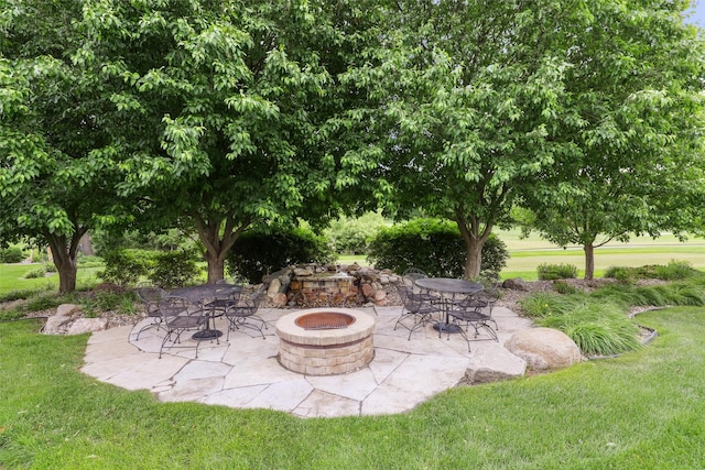1176 Glen Oaks Dr, West Des Moines, IA 50266 - view of patio / terrace featuring an outdoor fire pit