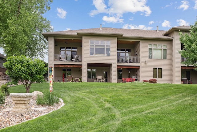 1176 Glen Oaks Dr, West Des Moines, IA 50266 - back of property with a balcony and a yard