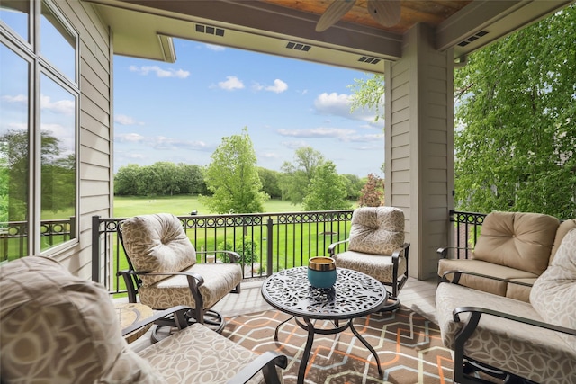 1176 Glen Oaks Dr, West Des Moines, IA 50266 - balcony with ceiling fan and view of wooded area