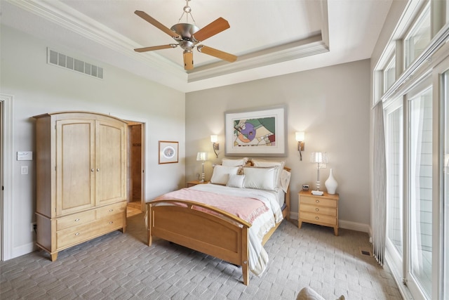 1176 Glen Oaks Dr, West Des Moines, IA 50266 - bedroom featuring light carpet, a tray ceiling, ornamental molding, baseboards, and ceiling fan